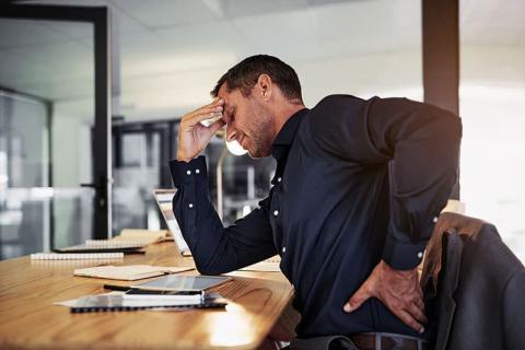Man holding painful back