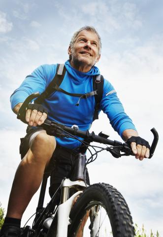 Older man mountain biking